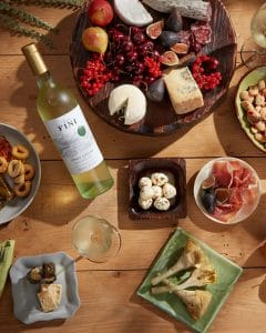 Lifestyle photography with food and wine on a table